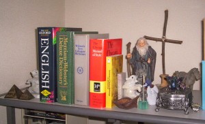 My essential reference shelf: dictionaries (Oxford and Webster's), The Chicago Manual of Style, and Zimmerman's Dictionary of Classical Mythology.
