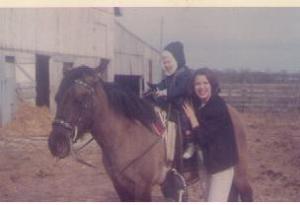 1968: That's me, with the barn in the background. That's a good friend of our family's, and I think that's her horse, not Dad's.